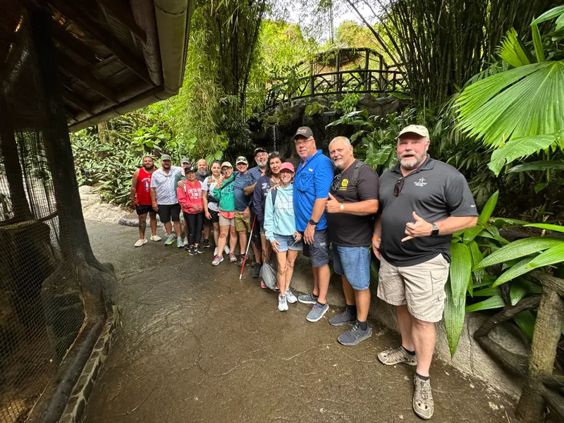 The same group along the garden path, closer to the stone footbridge.